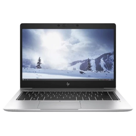 HP laptop with a snowy mountain scene on the screen against a white background