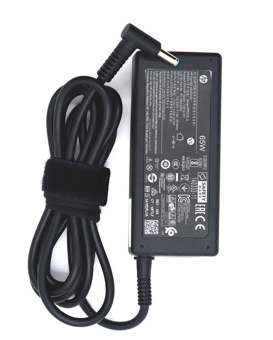 HP laptop adapter with power cord on a white background