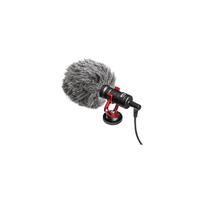BOYA BY-MM1 cardioid condenser shotgun microphone with shock mount and deadcat windshield mounted on a camera